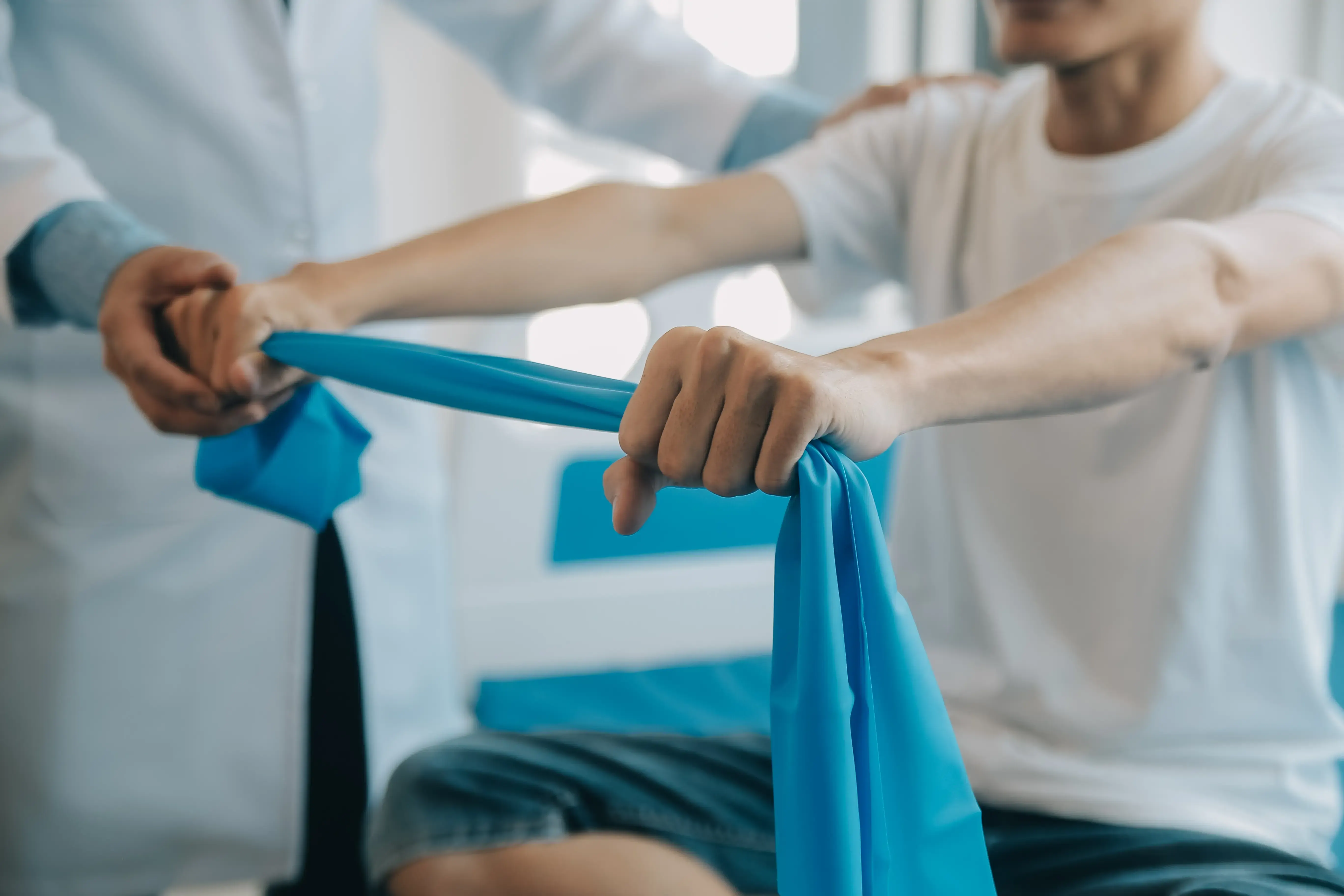 Patient performing rehabilitative exercises with provider guidance at Spine-Ability in Apollo Beach, FL